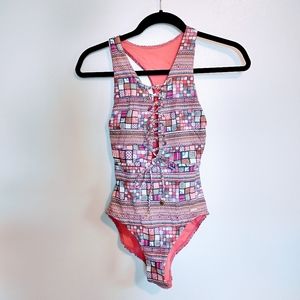 Sunseeker one piece swimsuit. Front lace up detail and geometric pattern. US siz